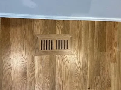 Oak hardwood flooring with integrated wooden floor register vent